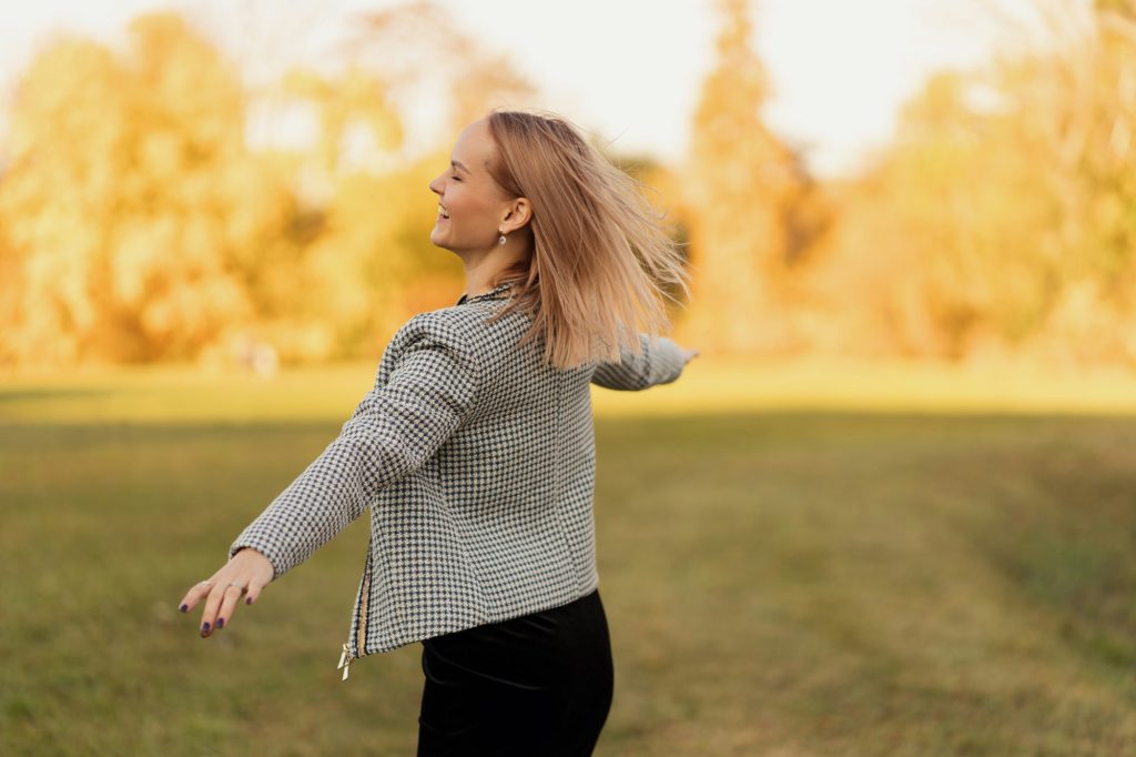 Woman happy enjoys nature moving around